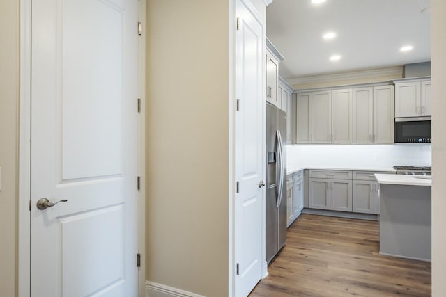 kitchen featuring hardwood / wood-style floors, stainless steel fridge with ice dispenser, and gray cabinets