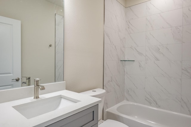 full bathroom with toilet, vanity, and tiled shower / bath