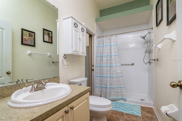 bathroom featuring toilet, a shower with curtain, vanity, and tile patterned floors