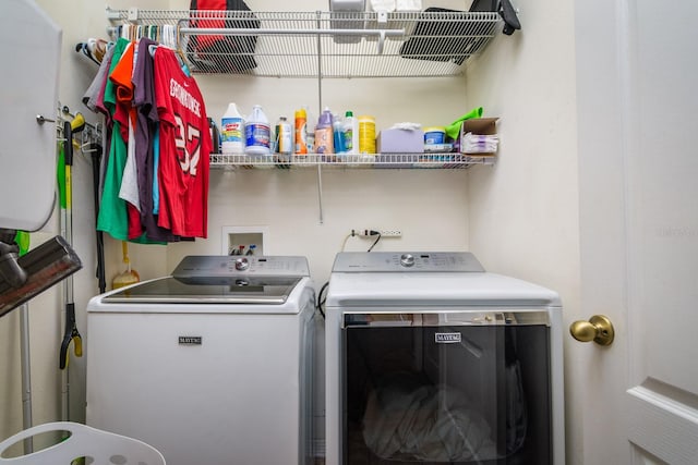 laundry area with independent washer and dryer