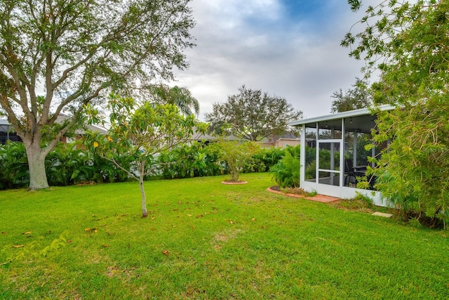 view of yard featuring a sunroom