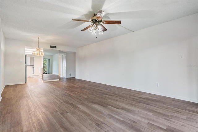 unfurnished living room with a textured ceiling, hardwood / wood-style floors, and ceiling fan