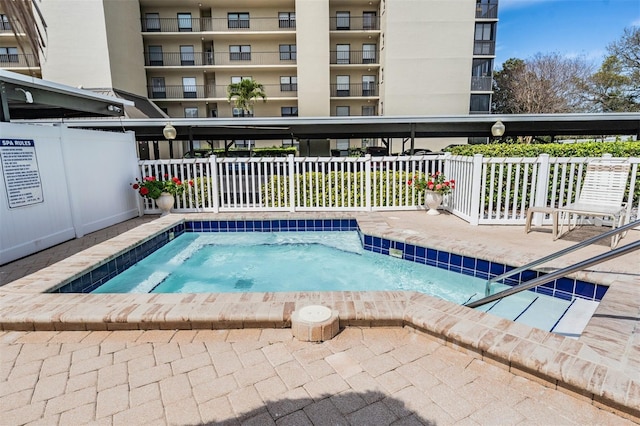 view of pool featuring a community hot tub