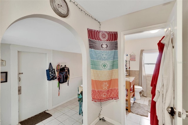 interior space featuring light tile patterned floors