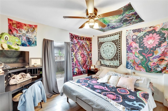 bedroom featuring hardwood / wood-style flooring and ceiling fan