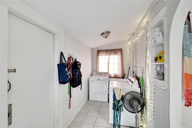 laundry room featuring separate washer and dryer and light tile patterned flooring