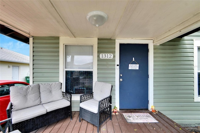 entrance to property with outdoor lounge area