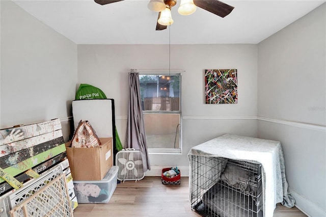 interior space with hardwood / wood-style floors and ceiling fan