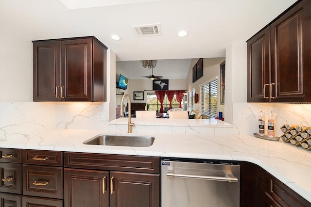 kitchen featuring decorative backsplash, ceiling fan, dishwasher, and sink