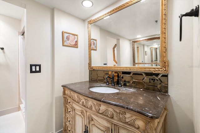 bathroom featuring decorative backsplash and vanity