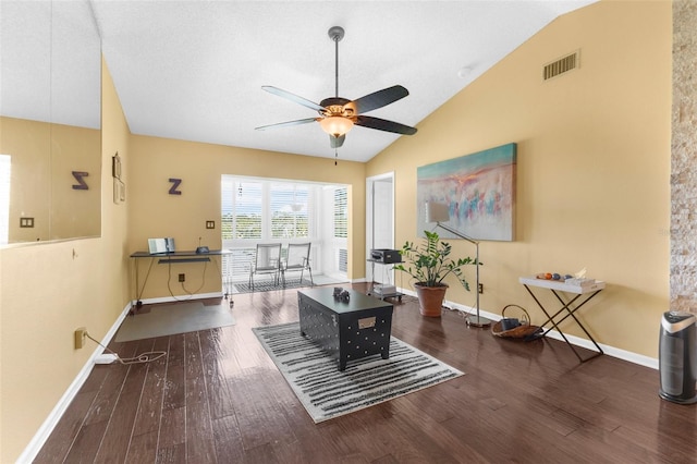 interior space with ceiling fan, dark hardwood / wood-style flooring, and lofted ceiling