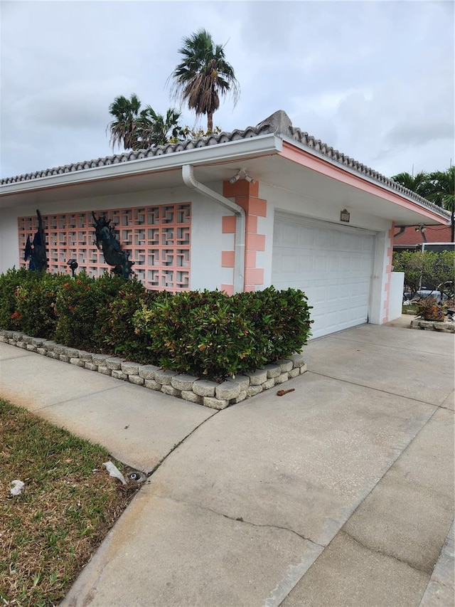 view of property exterior featuring a garage