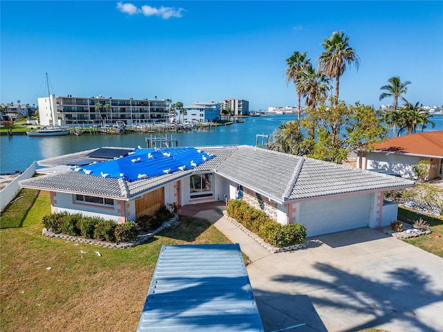 birds eye view of property with a water view