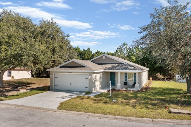 single story home with a garage and a front lawn