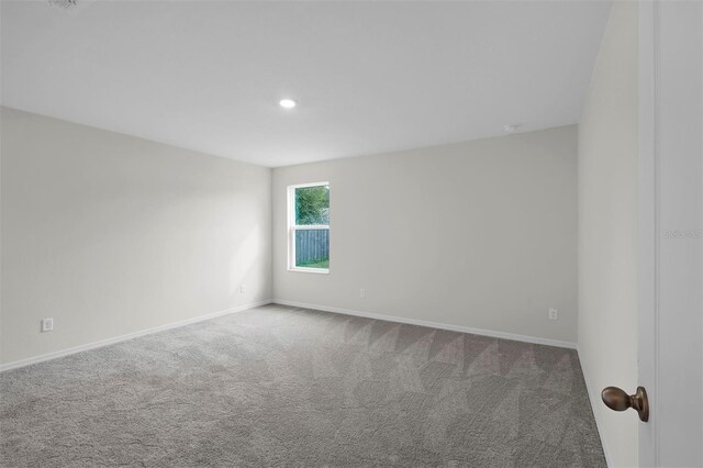 57 Pritchard Dr, Palm Coast, FL 32164 - carpeted empty room featuring baseboards and recessed lighting