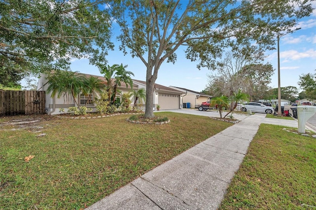 single story home featuring a garage and a front lawn