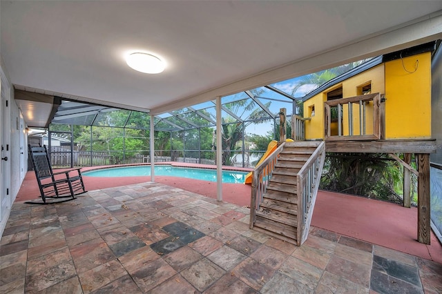 view of pool with a lanai and a patio area