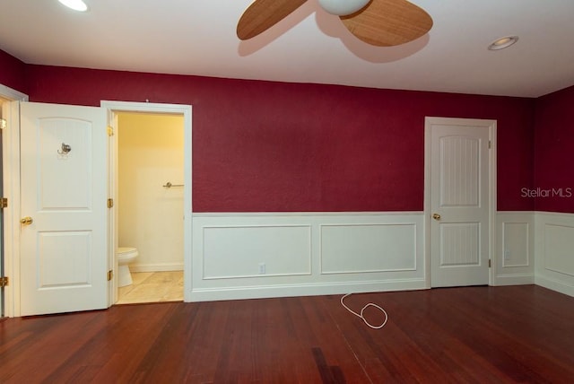 empty room with wood-type flooring and ceiling fan