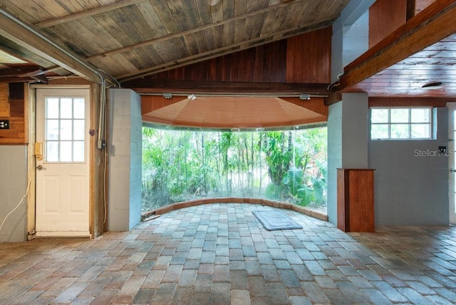 entryway with lofted ceiling, wood ceiling, and plenty of natural light