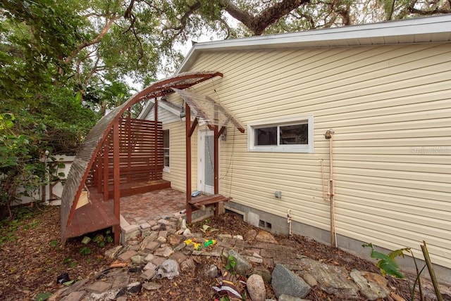 view of home's exterior with a wooden deck