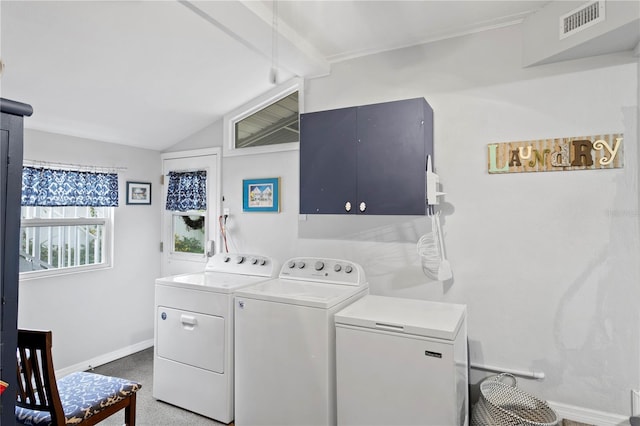 washroom featuring washer and clothes dryer, cabinets, and carpet