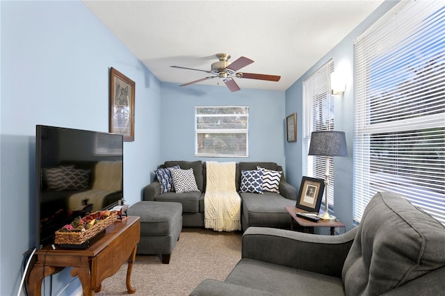 living room with light carpet and ceiling fan