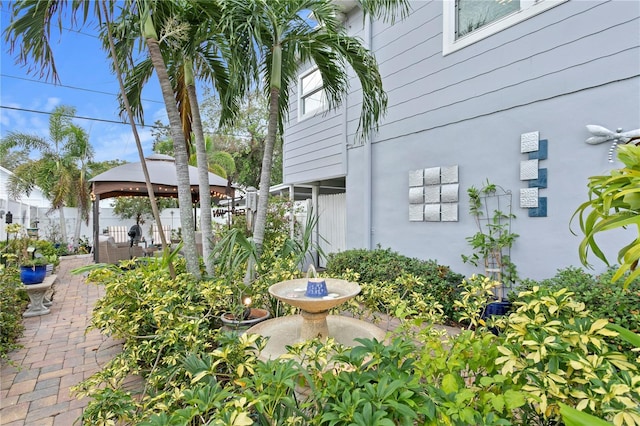 view of yard with a gazebo and fence