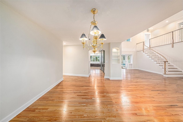 interior space featuring light hardwood / wood-style floors and a chandelier