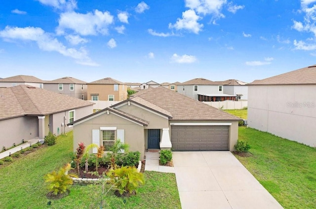 ranch-style house featuring a garage and a front lawn