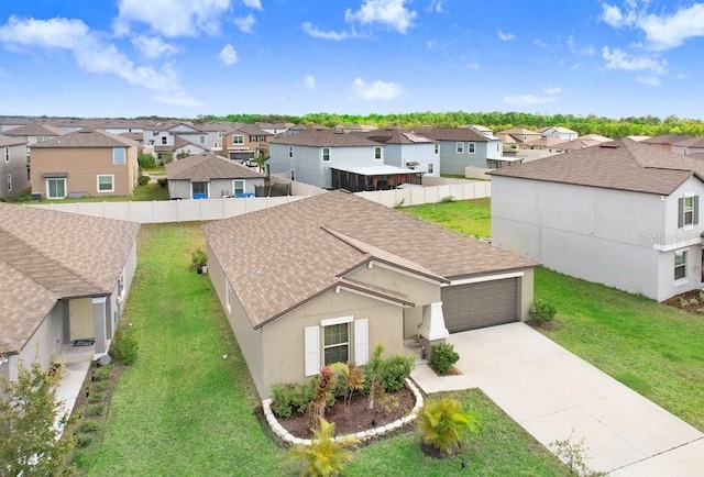 view of front of home featuring a garage and a front lawn