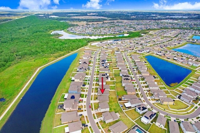 birds eye view of property with a water view