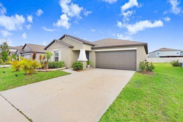 view of front of house with a garage and a front yard