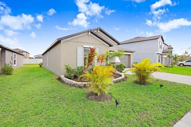 view of side of home featuring a garage and a yard