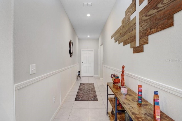 9407 Channing Hill Dr, Ruskin, FL 33573 - entryway with recessed lighting, visible vents, wainscoting, and light tile patterned floors