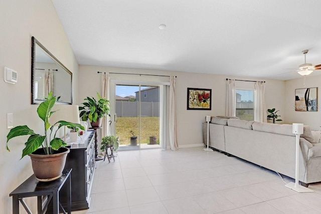 9407 Channing Hill Dr, Ruskin, FL 33573 - living area with ceiling fan, baseboards, and light tile patterned floors