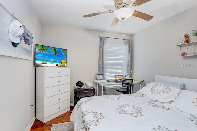 9407 Channing Hill Dr, Ruskin, FL 33573 - bedroom with baseboards, a ceiling fan, and wood finished floors