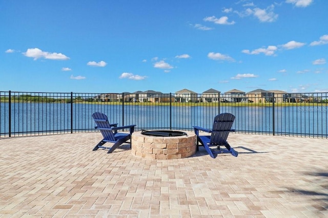9407 Channing Hill Dr, Ruskin, FL 33573 - view of patio / terrace featuring a fire pit, a residential view, and a water view