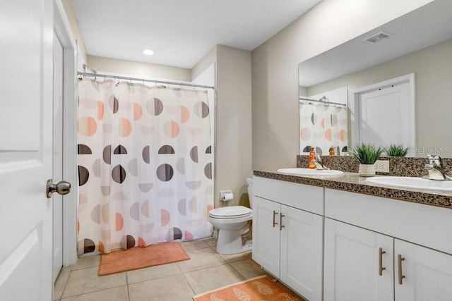 9407 Channing Hill Dr, Ruskin, FL 33573 - full bath with a sink, double vanity, toilet, tile patterned flooring, and visible vents