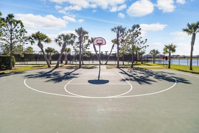9407 Channing Hill Dr, Ruskin, FL 33573 - view of basketball court featuring fence, community basketball court, and a water view