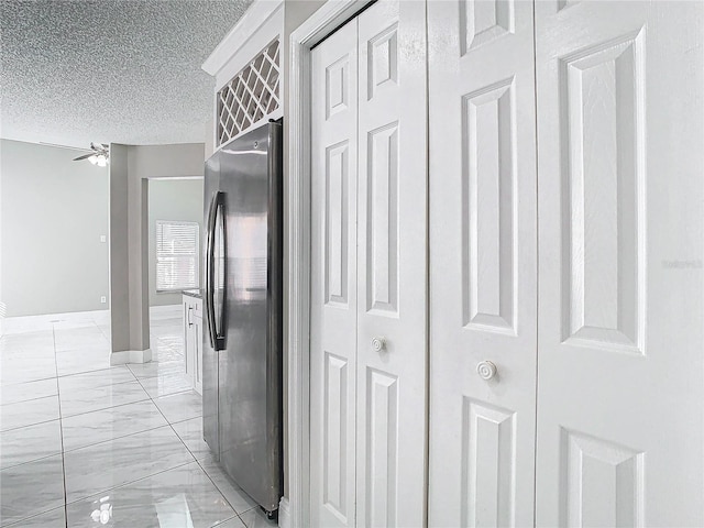 corridor with a textured ceiling