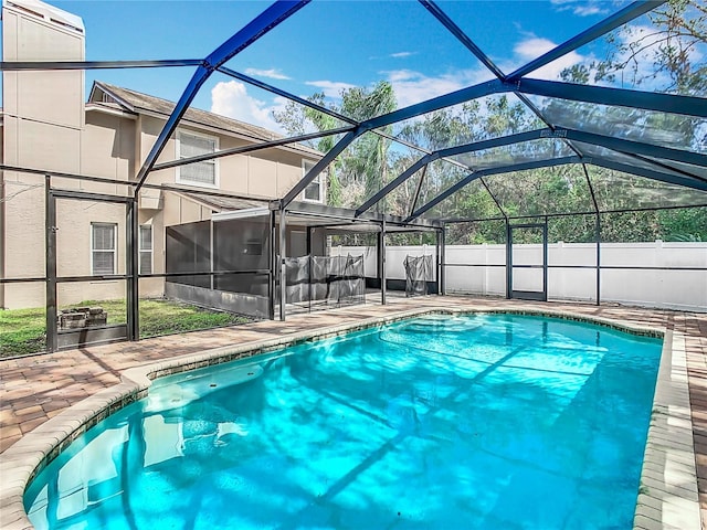 view of pool featuring a lanai and a patio area