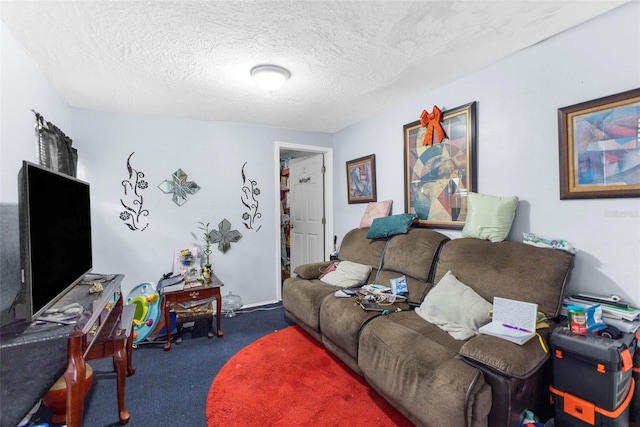 living room with dark colored carpet and a textured ceiling