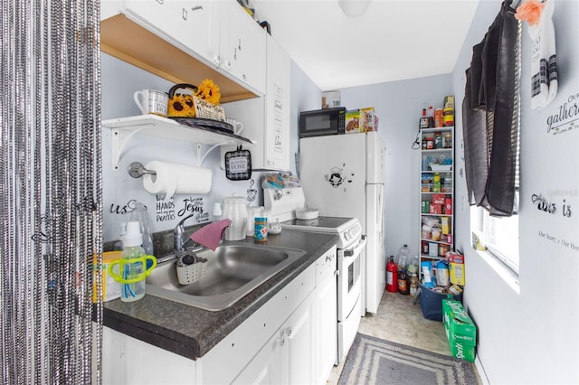 kitchen with sink, white electric range, and white cabinets