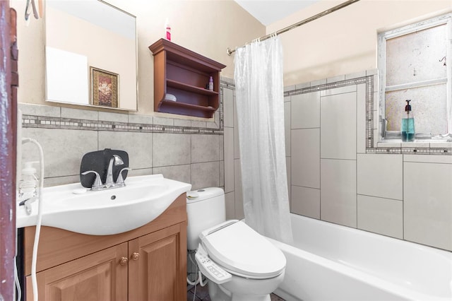 full bathroom featuring shower / tub combo with curtain, vanity, tile walls, and toilet