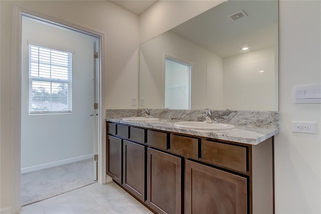 33351 Apricot Tree Ct, Wesley Chapel, FL 33543 - bathroom featuring double vanity and tile patterned flooring