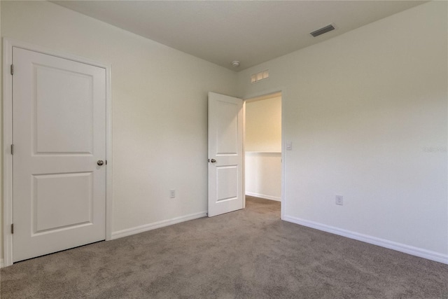 33351 Apricot Tree Ct, Wesley Chapel, FL 33543 - unfurnished bedroom featuring carpet floors and baseboards