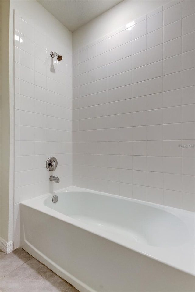 33351 Apricot Tree Ct, Wesley Chapel, FL 33543 - bathroom with tub / shower combination and tile patterned flooring
