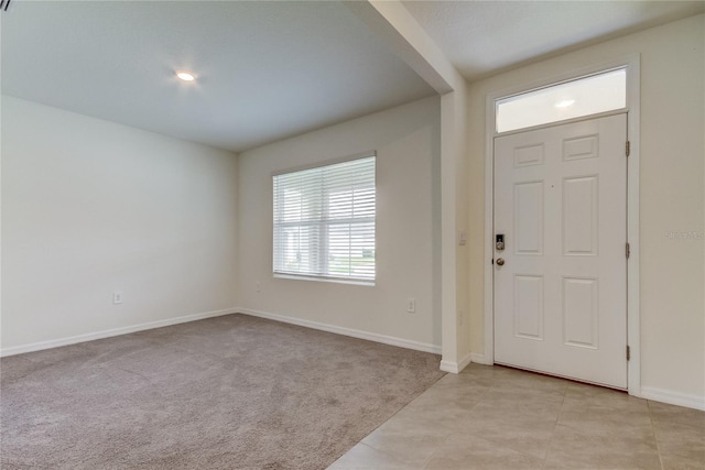 33351 Apricot Tree Ct, Wesley Chapel, FL 33543 - foyer with light colored carpet and light tile patterned flooring