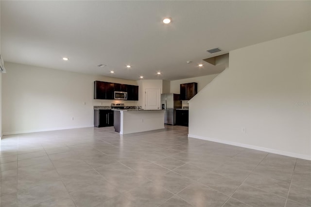 33351 Apricot Tree Ct, Wesley Chapel, FL 33543 - unfurnished living room featuring recessed lighting and light tile patterned floors