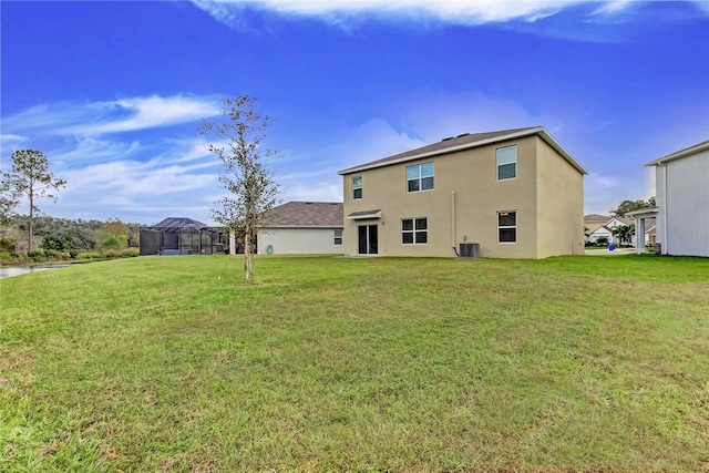 33351 Apricot Tree Ct, Wesley Chapel, FL 33543 - back of property with stucco siding and a yard